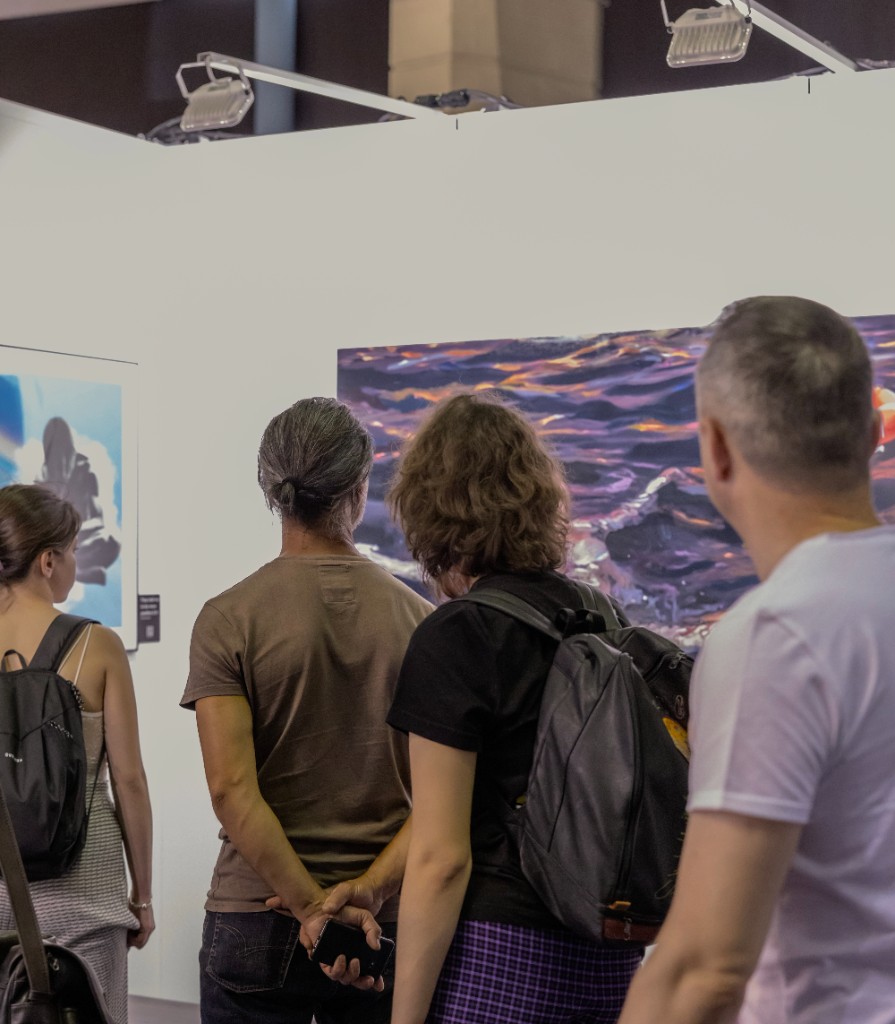 Visitors viewing work in the MoBU fair hall